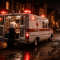 A 1960s era ambulance on a Hill District Pittsburgh street at night, emergency lights reflecting off wet pavement, crew preparing equipment at the rear doors, capturing the pioneering work of Freedom House Ambulance.