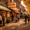 Murray Avenue in Pittsburgh's Squirrel Hill neighborhood on an autumn afternoon, the tree-lined commercial street showing Jewish delis and bakeries with residents walking past, capturing the enduring community character of one of Pittsburgh's most beloved neighborhoods.